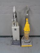 A Dyson DC7 Cyclone vacuum and a Seabo automatic X1 vacuum