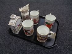 A tray of four Coalport commemorative tankards,