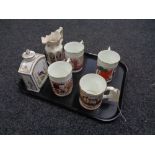 A tray of four Coalport commemorative tankards,