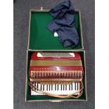 A cased Hohner Atlantic IV accordion