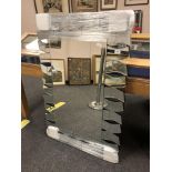 An all glass contemporary wave mirror,