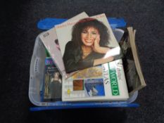 A crate of two Shirley Bassey LP's, assorted books, novels,