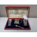 A silver cruet set, Birmingham 1898, Deakin & Francis, boxed.