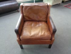 A mid 20th century Danish brown leather armchair