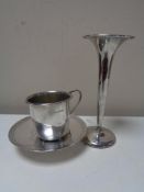 A silver fluted vase, together with a silver paten, and small silver cup.