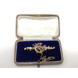 A 9ct gold Victorian brooch modelled as birds on a branch