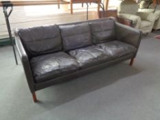 A mid 20th century Danish brown leather three seater settee