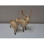 A pair of Beswick figures, stag with doe.