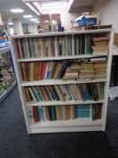 A set of mid 20th century Gibbs Furniture - painted open shelves containing four shelves of books
