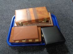 A tray of cased travel game sets.