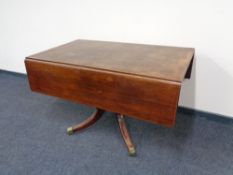 A Victorian mahogany pedestal pembroke table