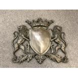 A cast bronze heraldic plaque,