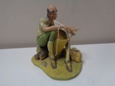 A Coalport figure, Basket Maker,