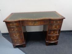 A good quality reproduction twin pedestal desk with tooled leather top