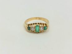 An antique 18ct gold emerald and diamond ring, size M1/2 CONDITION REPORT: 3.