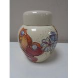 A Moorcroft lidded ginger jar, decorated with butterflies on cream ground, height 11 cm.