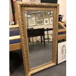 A 4' x 2' golden framed mirror