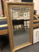 A 4' x 2' golden framed mirror