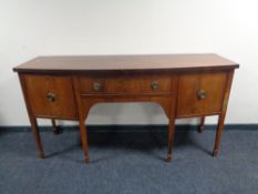 A 19th century bow-fronted inlaid mahogany sideboard CONDITION REPORT: 183cm wide