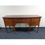 A 19th century bow-fronted inlaid mahogany sideboard CONDITION REPORT: 183cm wide