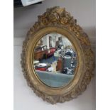 A Victorian composite frame oval mirror.