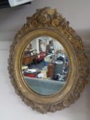 A Victorian composite frame oval mirror.