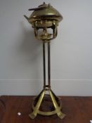A 20th century brass kettle on stand with burner