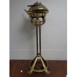 A 20th century brass kettle on stand with burner