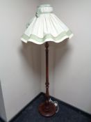 A 20th century stained beech standard lamp and shade