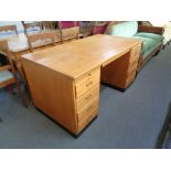 A mid 20th century oak twin pedestal desk