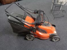 A Husquvana LC141C electric self drive lawnmower.