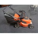 A Husquvana LC141C electric self drive lawnmower.