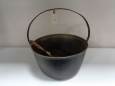 An antique brass jam pan and a brass coal shovel