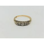 An 18ct gold five stone diamond ring, size N1/2 CONDITION REPORT: 2.