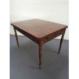 A mahogany kitchen table fitted a drawer