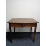 A 19th century mahogany writing table fitted a drawer