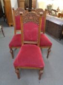 Three early 20th century carved oak dining chairs
