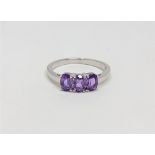 A silver amethyst dress ring,