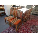 A blonde oak refectory table and six chairs