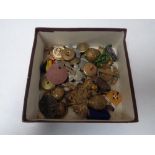 A box of military buttons, cap badges,