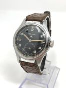 A stainless steel British Military Eterna wristwatch,