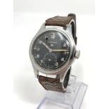 A stainless steel British Military Eterna wristwatch,