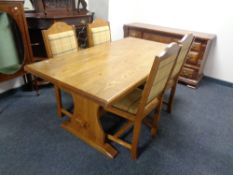 A contemporary refectory dining table together with a set of four dining chairs in tartan fabric