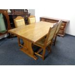 A contemporary refectory dining table together with a set of four dining chairs in tartan fabric