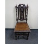 A carved oak barley twist hall chair