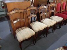 A set of six antique walnut dining chairs