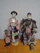 A large Japanese warrior figure and two oriental style figures