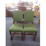 A pair of carved oak high back chairs