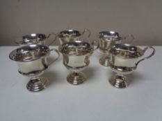 A near match set of six silver punch cups, dates various.