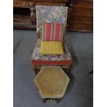 A carved oak tapestry armchair and three various footstools